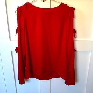 Red blouse with open ties on sleeves by CeCe